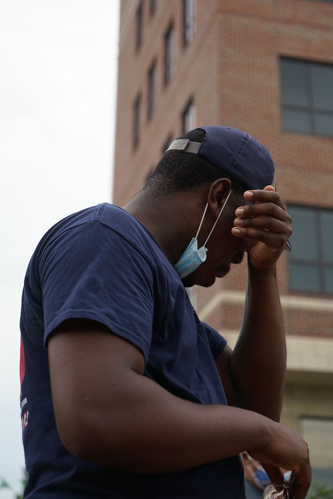 Will Lyon of Boone County Fire wipes his eyes on Friday